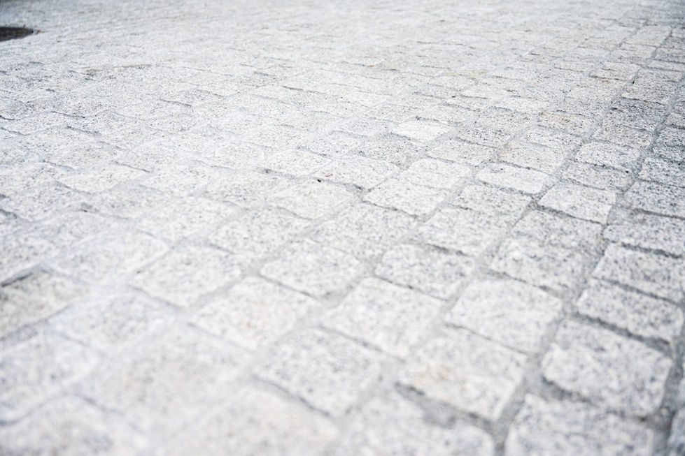 High-quality natural stone paving for driveway and parking area