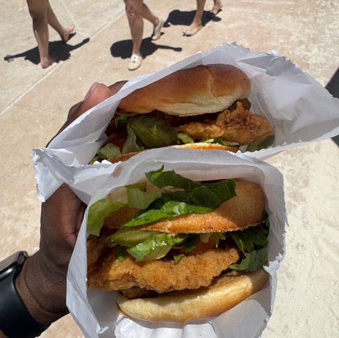 two secret sandwiches in hand