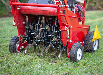 Core Aerator Machine pulling 2-inch cores from the lawn