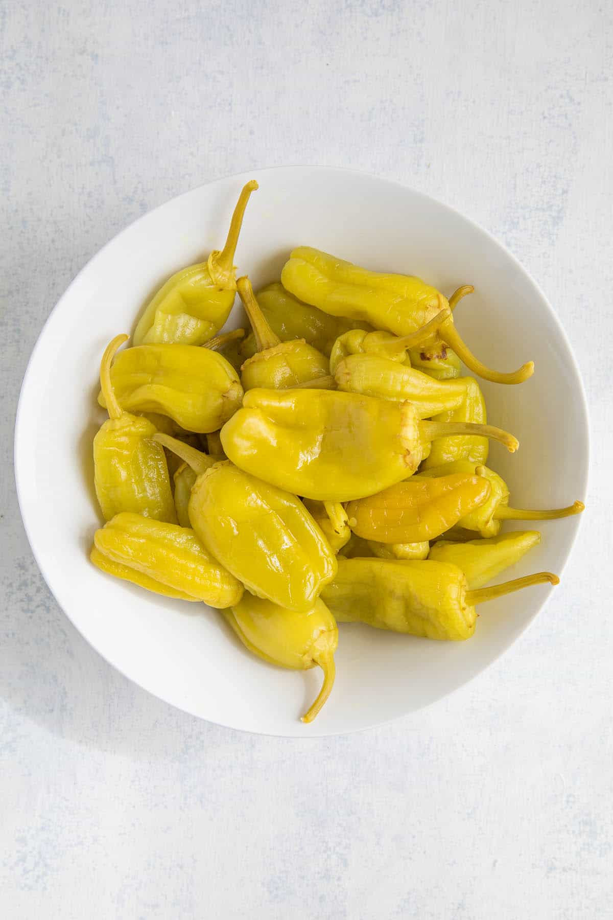 Packet of Pepperoncini Golden Greek pepper seeds for growing bright yellow peppers with a mildly piquant, fruity flavor. These versatile peppers are sweeter than the Italian varieties and perfect for pickling, salads, or enjoying fresh.