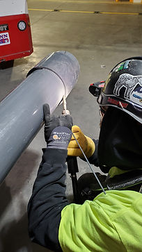 plumber welding large pipe