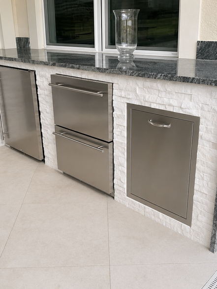 Outdoor kitchen with built-in stainless steel appliances