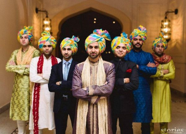 Grooms wearing bright leheriya print safas