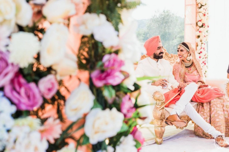 Bride & Groom wearing Salmon Pink colored outfits