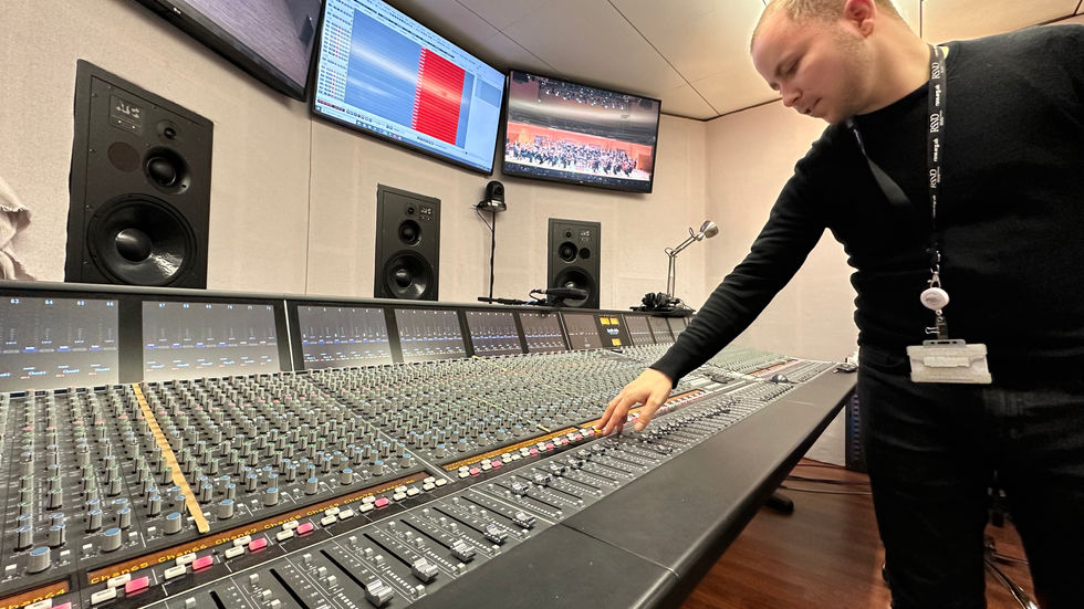 Sam explaining how to operate the SSL desk