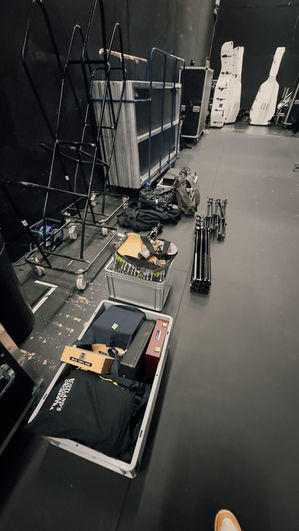 A picture of our equipment for the location recording including a bag of microphones, 2x Neve stageboxes, normal and tall microphone stands and a box of 5m, 10m and 15m XLR cables.