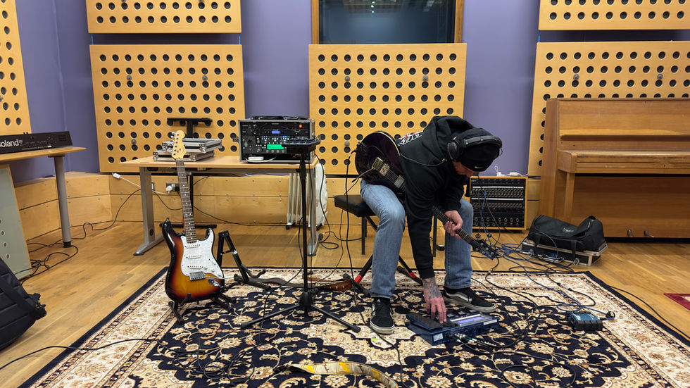 Lead guitarist Gav adjusting settings