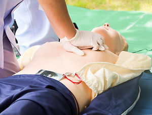 CPR on training doll with chest compres