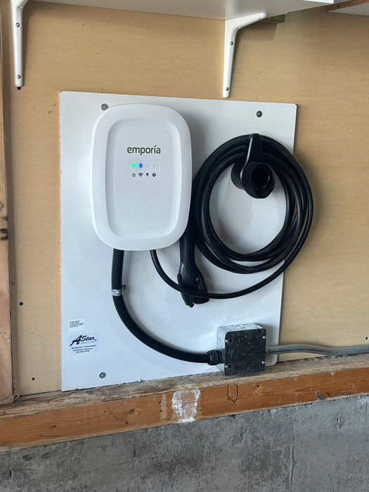 Emporia EV charger installed on garage wall