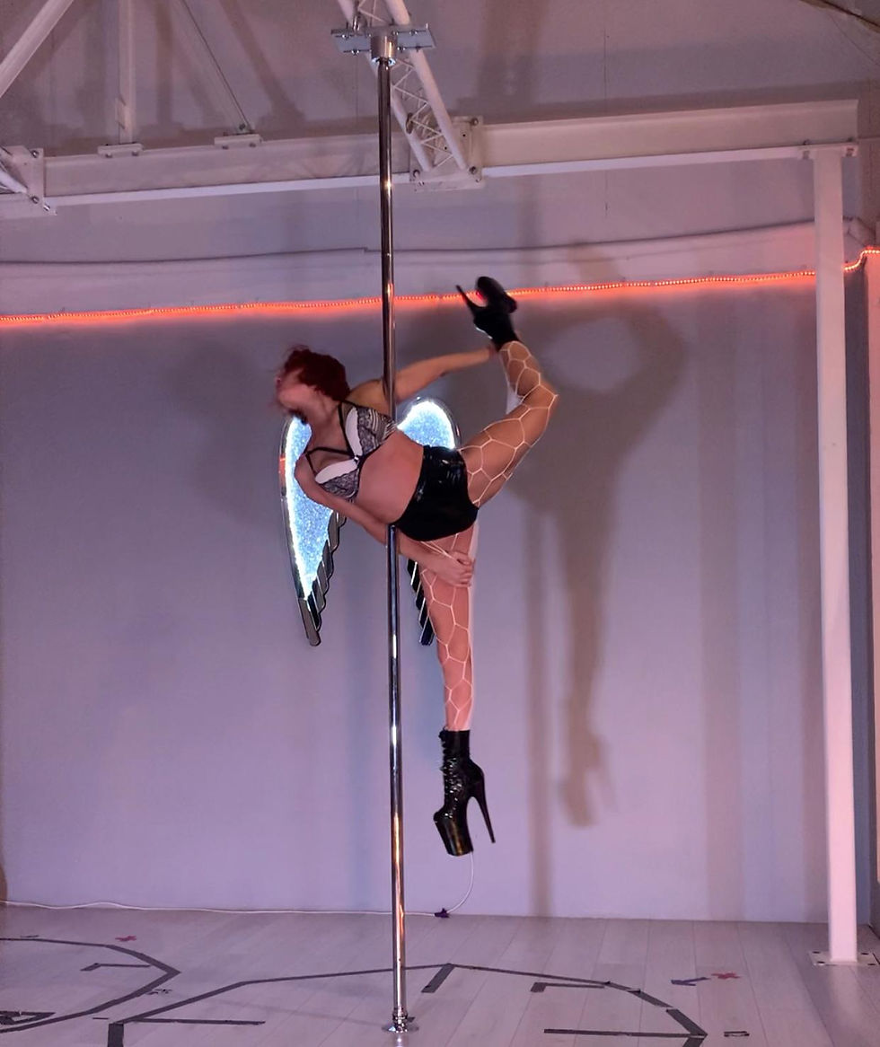 Thumbnail: Pole dancer on a pole wearing white Mega Net Tights