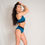 Thumbnail: Okami Studios Reversible Infinity Shorts Black & Teal Folded Over side View