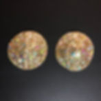 two Gold Multi Glitter Circle Pasties on a Black Background