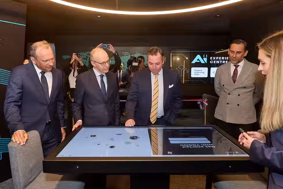 Group of people around a technology casing