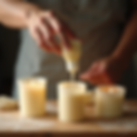 lifestyle photography refilled candle containers workshop setting hands pouring wax natura