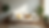 Eye-level view of a tidy living room with a cozy sofa and decorative plants