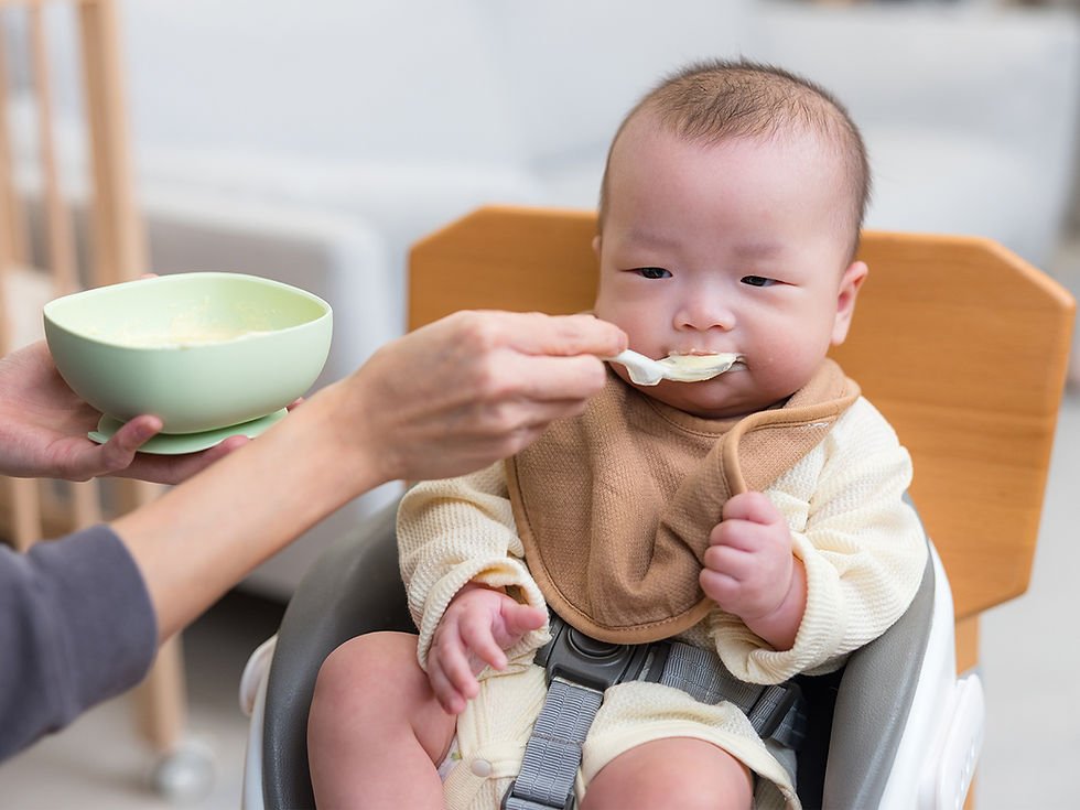 Feeding baby with mash at home