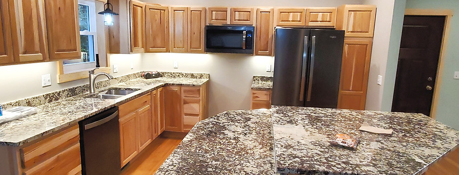 Kitchen with maple cabinets granite countertops large island