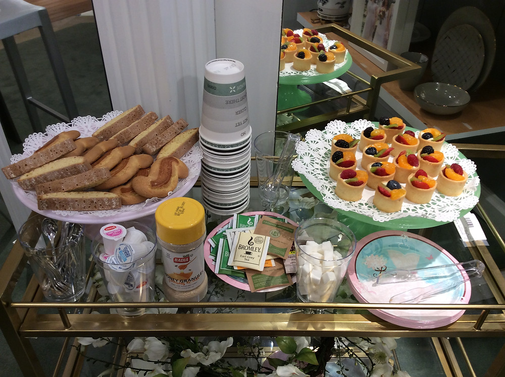 food and tea on a bar cart