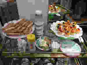 food and tea on a bar cart