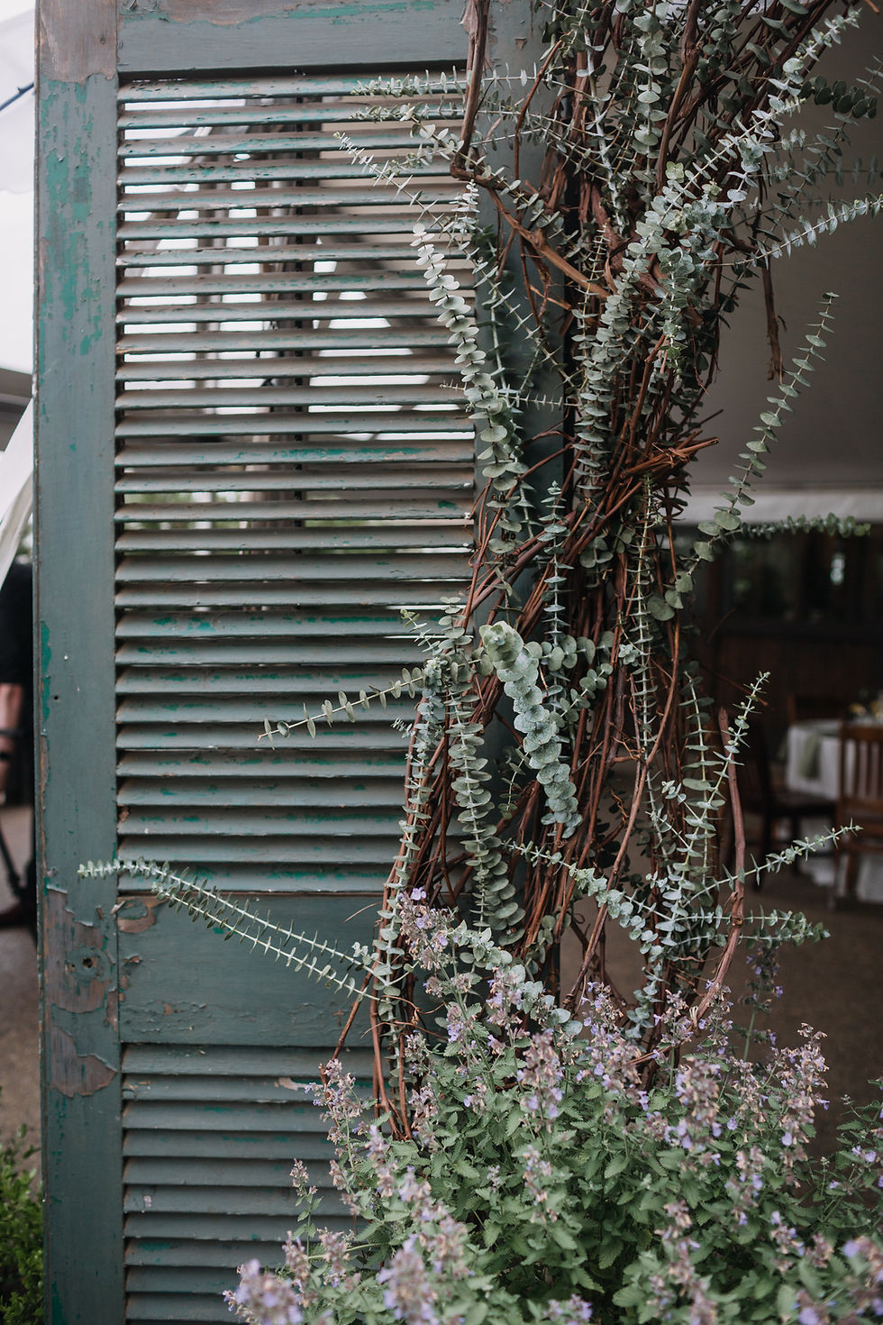 painted wooden shutter decorated with florals