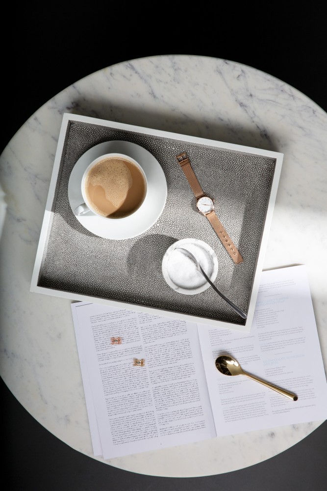 tray with a cup of coffee and watch