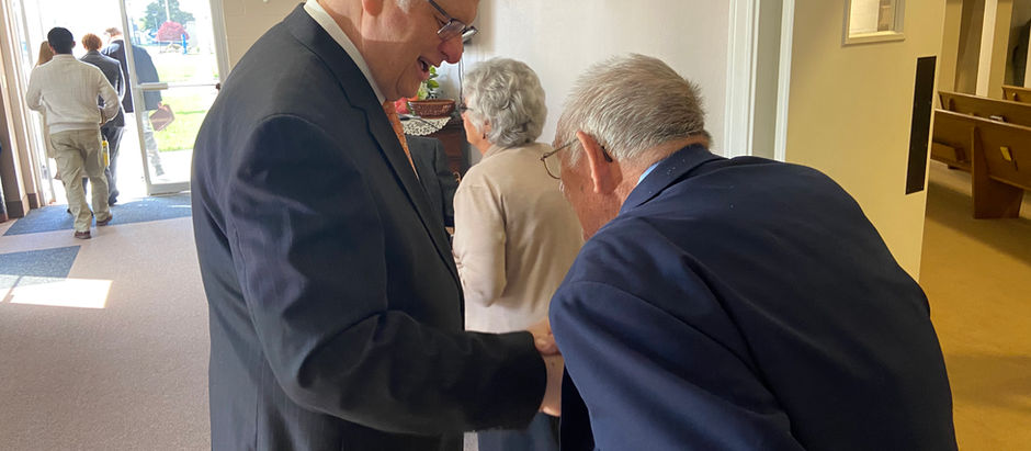 Dr. Baker greets church attendees