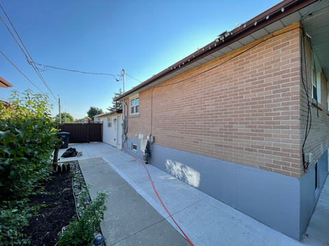 Pressure Washing | Brampton, ON | Concrete walkway that's been pressure washed. Shows the difference between a portion that has not been washed and one that has been.