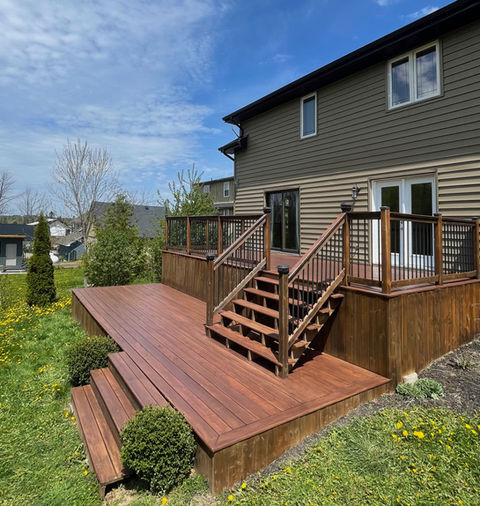 Deck Stain | Erin, ON | A that was pressure washed and stained with a warm dark stain.