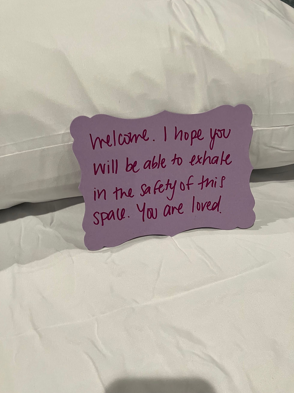 Volunteers compose welcome notes to greet Bethanie's Room homeless guests.