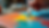 Close-up view of a painter’s brush touching a canvas with vibrant colors