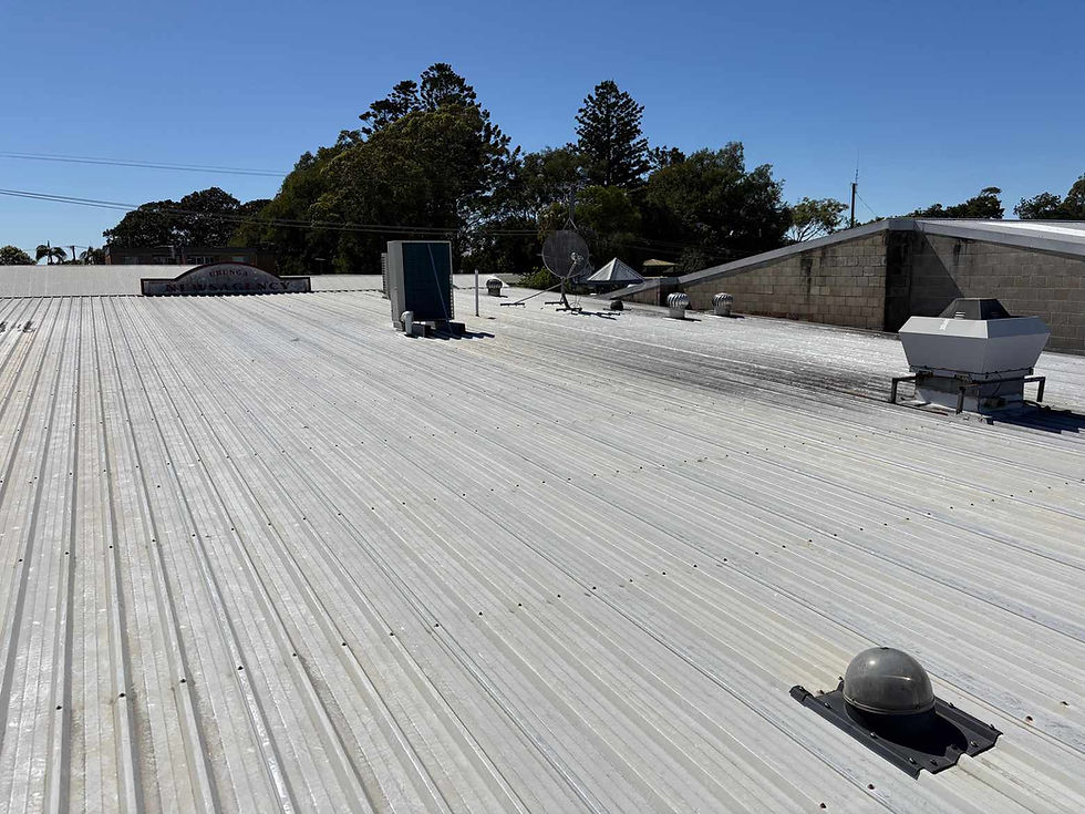 Low-slope metal deck commercial roof inspection showing ventilation penetrations and parapet wall detail — independent commercial roof inspection Sydney by Insight RI
