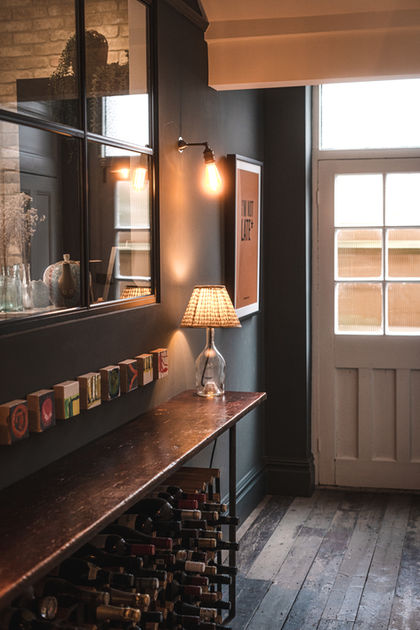 Cozy interior with lamp, mirror, and decorative items.