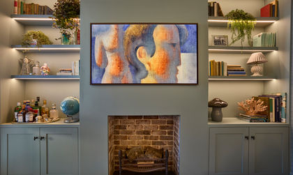 Artwork above fireplace, surrounded by shelves and decor.