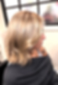 Blonde lob haircut with soft waves and a blended root shadow