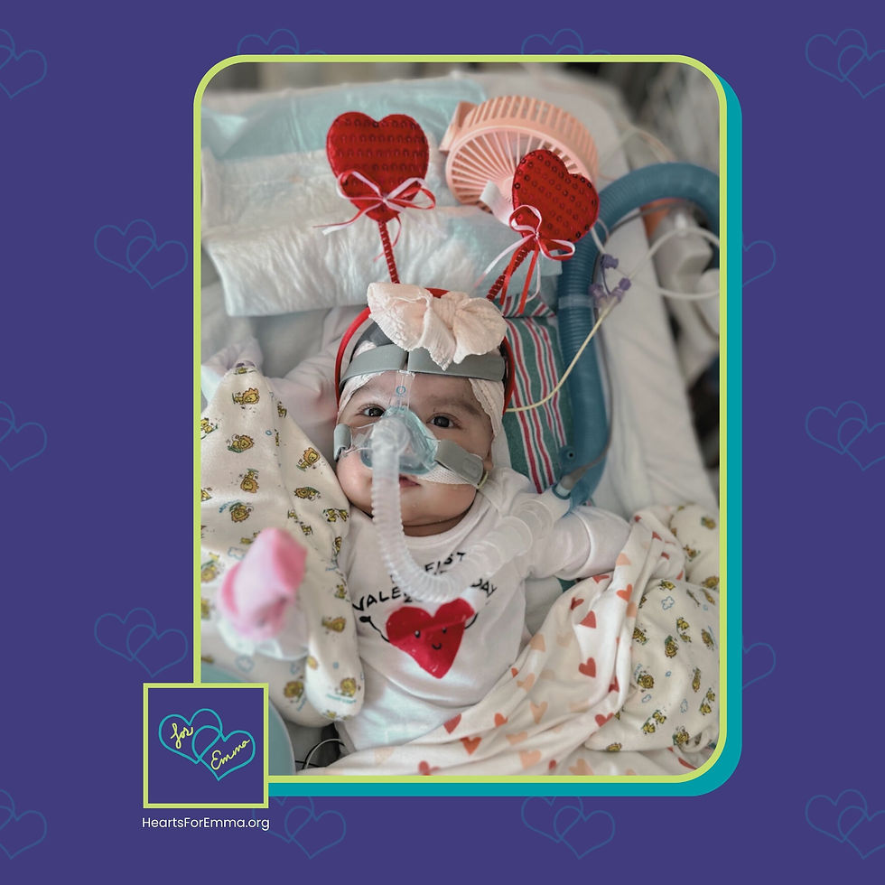 Picture of a young child in a hospital bed dressed up for Valentine's day.