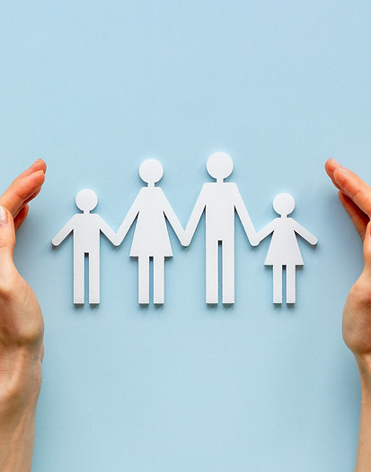 Hands holding family figure top view. Insurance concept.jpg
