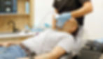 Anesthesiologist sedating a patient before dental implant treatment.