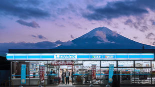 Japanese convenience store guide featuring 7-Eleven, FamilyMart, and Lawson with iconic foods like Famichiki fried chicken, onigiri rice balls, oden hot pot, and unique services such as ATMs, ticketing, and luggage delivery that make konbini a cultural experience in Japan