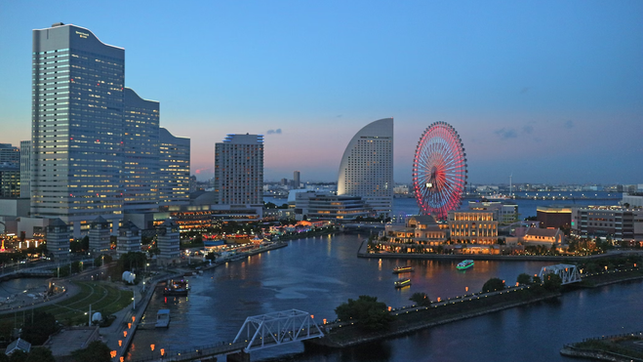 Yokohama, Japan’s vibrant port city south of Tokyo, blends historic charm and modern innovation along Tokyo Bay. Panoramic skyline views from Minato Mirai feature Landmark Tower, Cosmo Clock 21 Ferris Wheel, and the red-brick warehouses glowing at sunset. Travelers stroll through Yamashita Park’s seaside promenade, explore Yokohama Chinatown’s colorful gates and lanterns, and relax in Motomachi’s European-inspired cafés. The futuristic Osanbashi Pier and CupNoodles Museum showcase Japan’s creative culture, while the Shin-Yokohama Ramen Museum celebrates regional ramen flavors from Hokkaido to Kyushu. Couples enjoy night views across the bay, families visit the Marine Tower, and food lovers sample dim sum, sushi, and local Yokohama Beer by the waterfront. Perfect for day trips from Tokyo or weekend getaways, Yokohama offers art, shopping, and coastal romance — where Japan’s maritime history meets cutting-edge design under sparkling harbor lights.