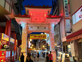 Sannomiya Kobe Japan with Kobe beef steakhouses, Chinatown alleys, Meriken Park, and Kobe Port skyline—bustling urban district near Sannomiya Station for tourists and locals exploring Kobe beef grilling contests, sake-tasting walks, Kobe Port Festival, street food, and cultural sightseeing in Japan’s port city.