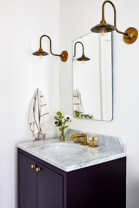 Bathroom with custom dark blue cabinetry