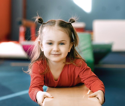 Young girl using occupational therapy equipment