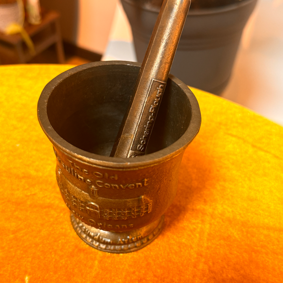 Brass mortar and pestle with enscription of "Sister Xavier first woman pharmacy in America 1734"