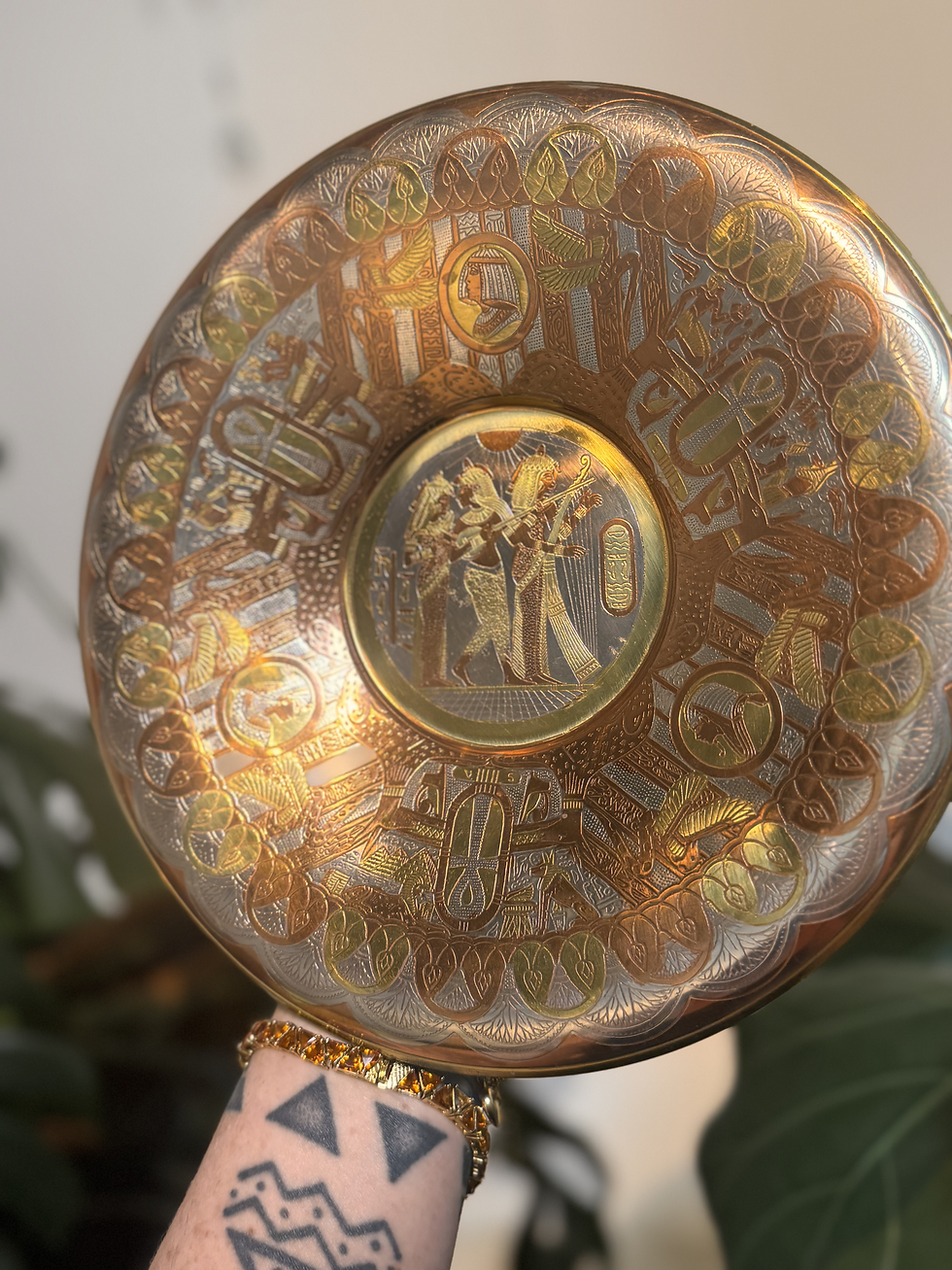 Round brass plate with Egyptian goddess iconography, Ankh and filigree