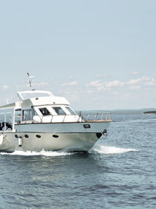 White boat in the water, Crab Island Charter, waves, salt air, Salty Anchor Charter.