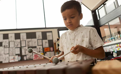 schoolboy-playing-xylophone-classroom_13339-354371_edited.jpg