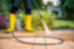 Image showing a professional power washing company using high pressure to clean paves.