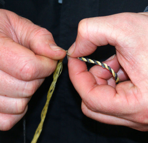 Making a handmade bow string to use on a wooden bow