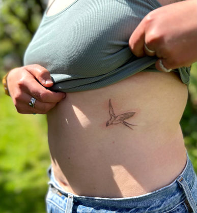 delicate swallow sailor tattoo handpoked in scotland