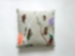 hand-painted cushion with bird and floral design